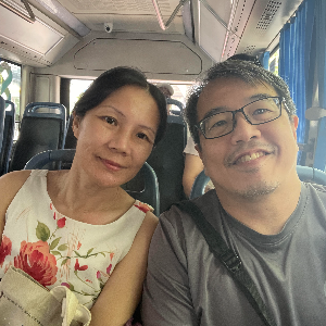Taking a lesiurely bus ride together in a foreign land